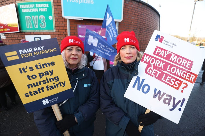 Nurses Sarah Donnelly (left) and Nicola Joyce on the picket line outside the Royal Victoria Hospital in Belfast, as nurses in England, Wales and Northern Ireland take industrial action over pay. Picture date: Tuesday December 20, 2022.