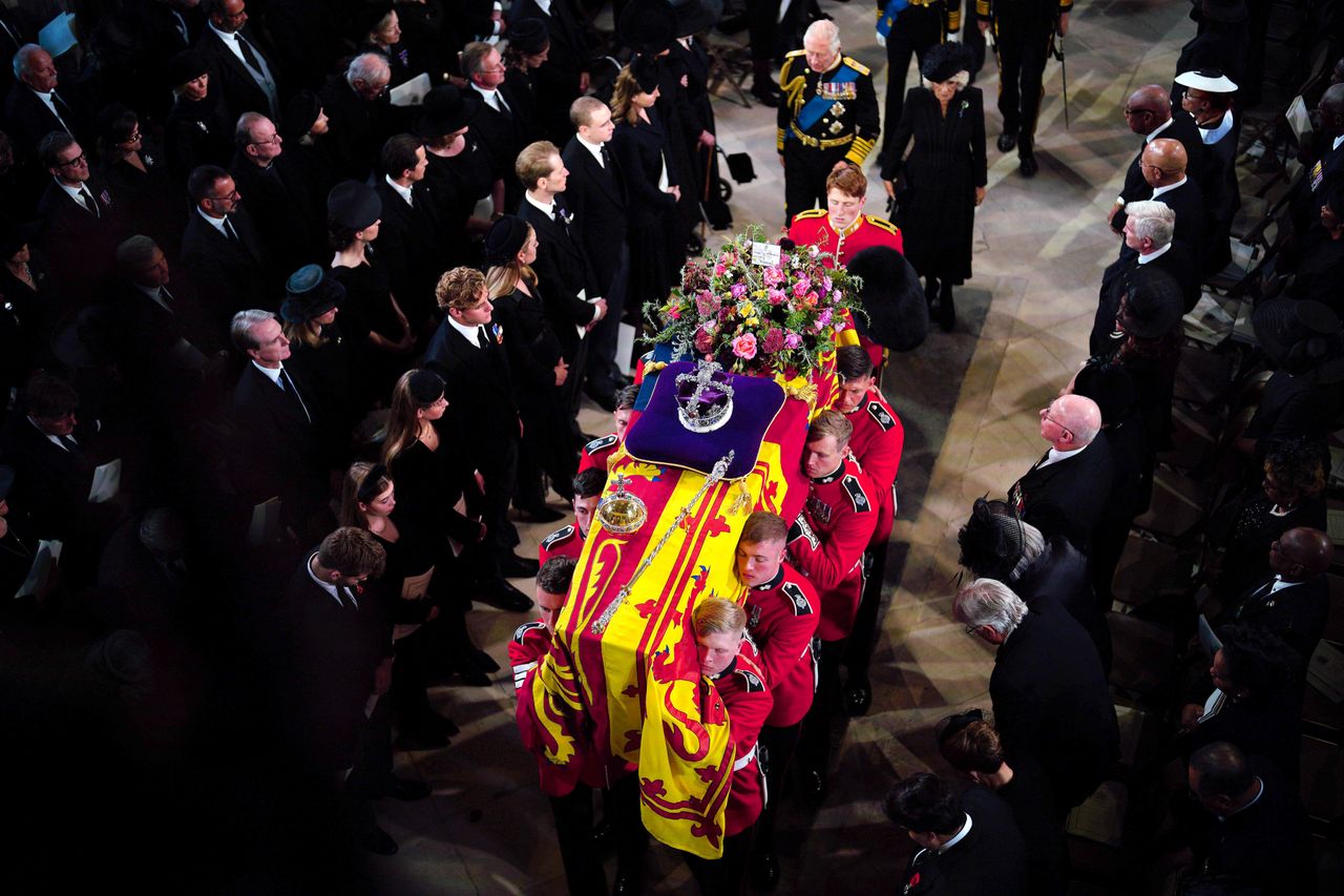 King Charles III and Camilla, Queen Consort, follow behind the coffin of Queen Elizabeth II as it is carried into St. George's Chapel in Windsor Castle, for the Committal Service on Sept. 19.