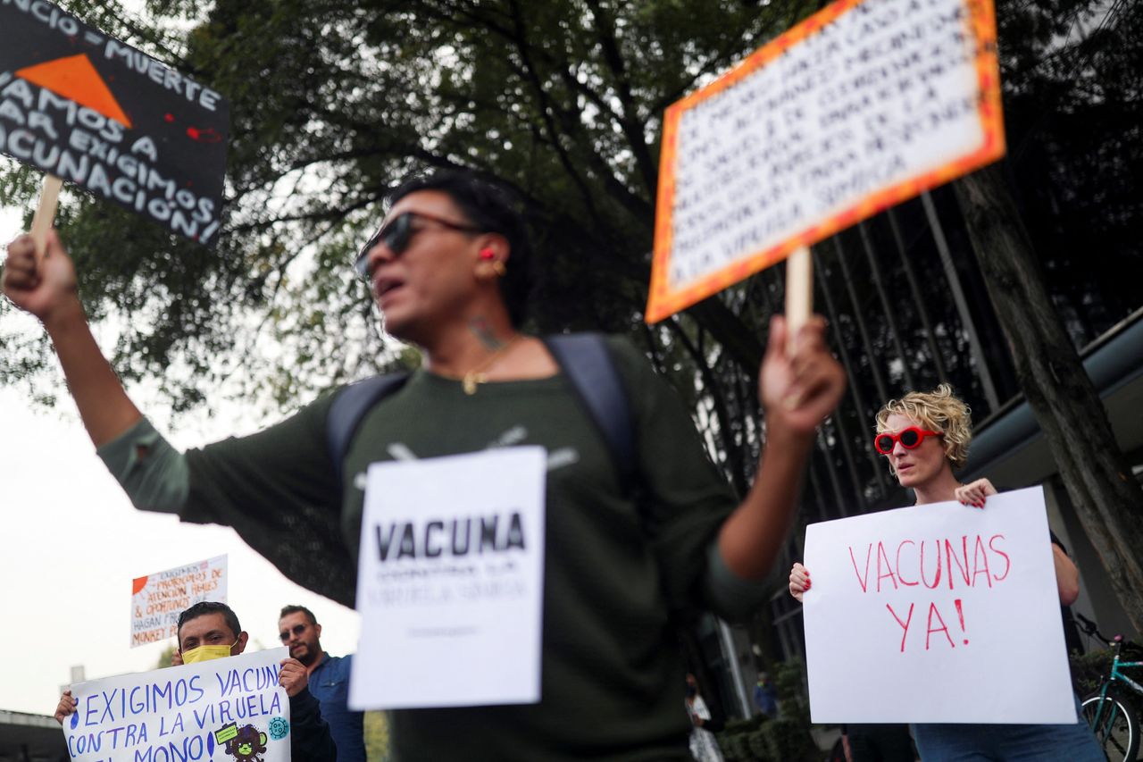 Activists hold signs as they demand a vaccine during a demonstration to call for a stronger response by the government to the mpox crisis outside the National Center for Preventive Programs and Disease Control building in Mexico City on Oct. 21.