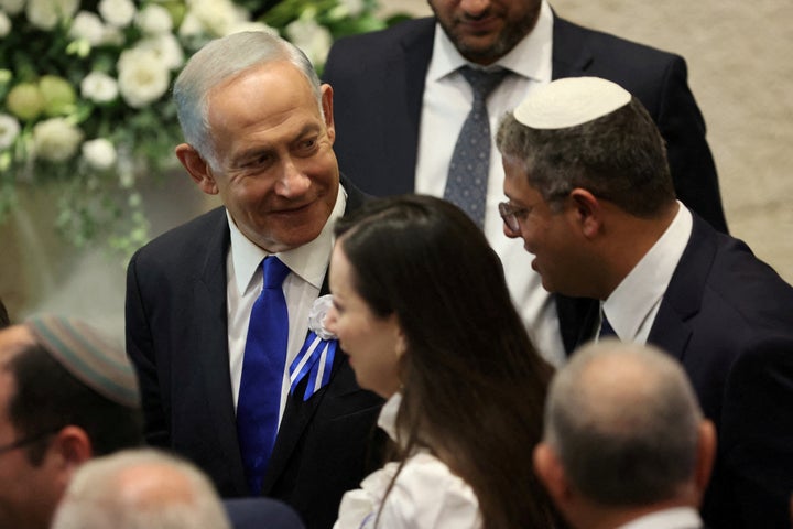 Israeli designate Prime Minister Benjamin Netanyahu and right-wing Knesset member Itamar Ben Gvir during the swearing-in ceremony for the new Israeli parliament the 25th Knesset in Jerusalem, November 15, 2022. Abir Sultan/Pool via REUTERS REFILE - CORRECTING INFORMATION