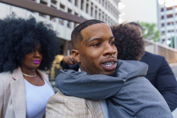 Rapper Tory Lanez, 30, walks out of the courthouse while holding his five-year-old son Kai'Lon on Tuesday in Los Angeles. The Canadian rapper has pleaded not guilty to discharging a firearm with gross negligence, assault with a semiautomatic firearm and carrying a loaded, unregistered firearm in a vehicle.