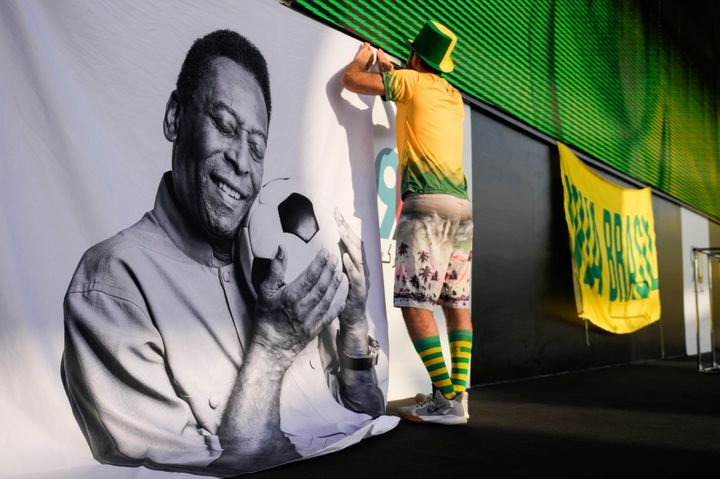 A fan displays a sign in support of Pelé at a Brazilian fan party during the recent World Cup.