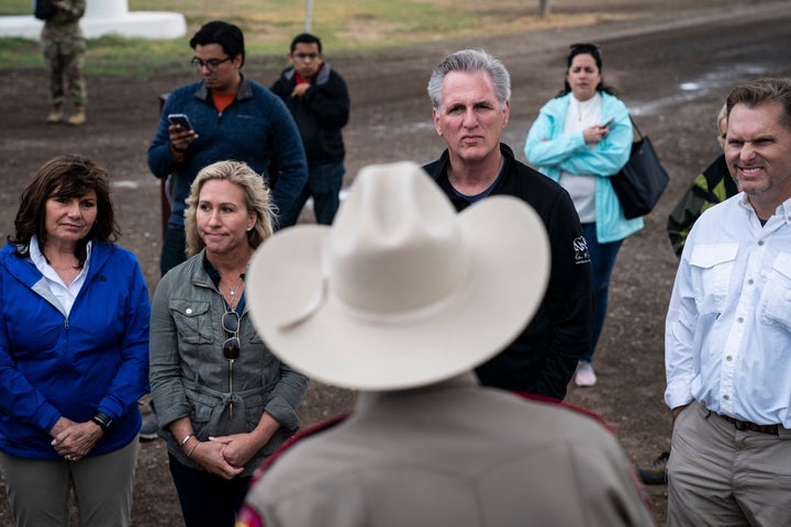 Rep. Diana Harshbarger (R-Tenn.), Rep. Marjorie Taylor Greene (R-Ga.), House Minority Leader Kevin McCarthy (R-Calif.) and Rep. Michael Guest (R-Miss.), receive a briefing under the Eagle Pass International Bridge to Mexico as McCarthy leads a group of fellow Republicans on a tour of the U.S.-Mexico border on April 25, 2022, in Eagle Pass, Texas.