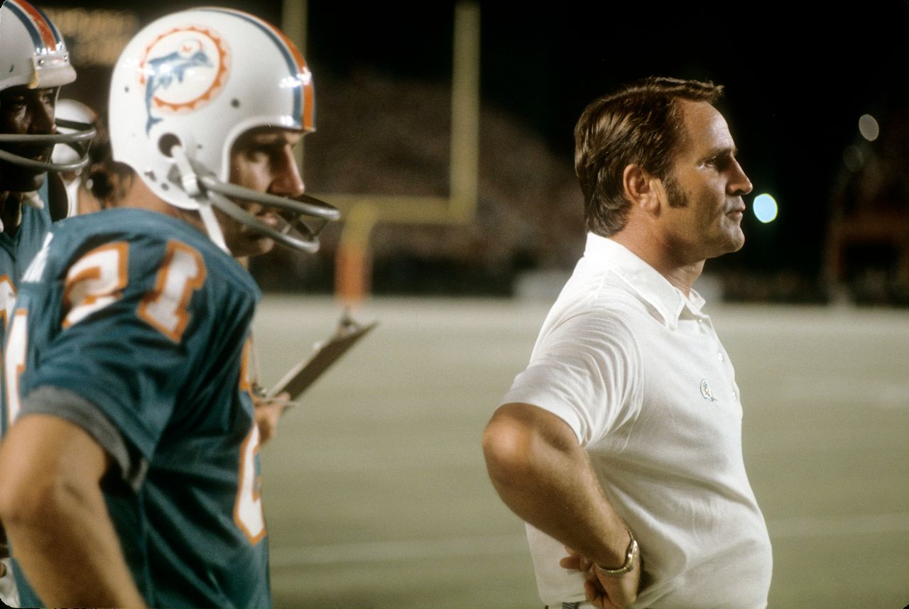 Don Shula (right), then the head coach of the Miami Dolphins, watches a game from the sidelines in the early 1970s in Miami, Florida.