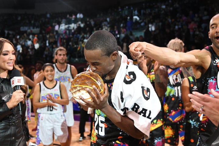 Alex Toussaint #25 of Team Walton after winning the NBA All-Star Ruffles Celebrity Game MVP Trophy during the Ruffles NBA All-Star Celebrity Game on February 18, 2022, at Wolstein Center in Cleveland, Ohio.