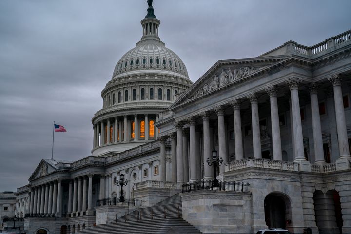 The Senate side of the Capitol is seen in Washington, early Thursday, Dec. 22, 2022, as lawmakers rush to complete passage of a bill to fund the government before a midnight Friday deadline, at the Capitol in Washington, Thursday, Dec. 22, 2022. (AP Photo/J. Scott Applewhite)