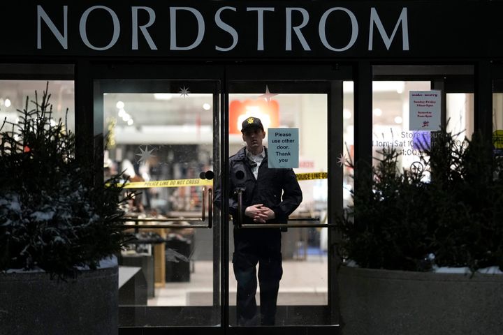 An officer stands inside the Nordstrom at the Mall of America after a shooting on Friday.