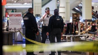 Security officers speak inside a store at the Mall of America in Bloomington, Minn., after reports of shots fired on Friday, Dec. 23, 2022. (Kerem Yücel/Minnesota Public Radio via AP)