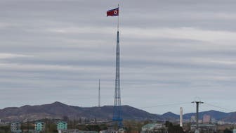 FILE - A North Korean flag flutters in the wind atop a 160-meter tower in North Korea's village Gijungdongseen, as seen from the Taesungdong freedom village inside the demilitarized zone in Paju, South Korea, on April 27, 2018. South Korea said Monday, Dec. 26, 2022, it fired warning shots after North Korean drones violated the South’s airspace. (AP Photo/Lee Jin-man, File)