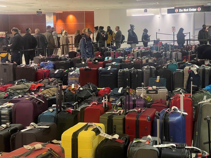 BALTIMORE, MD - DEC 27: In addition to flight delays,cancellations, and reportedly a ticket system crash, hundreds of passengers wait in line to handle their baggage claim issues with Southwest Airlines at Baltimore/Washington International Thurgood Marshall Airport in Baltimore, Maryland on December 27, 2022.(Photo by Marvin Joseph/The Washington Post via Getty Images)