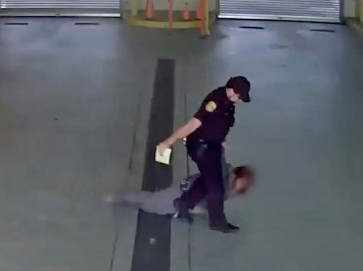 In this image taken from video released by the Tampa Police Department, police officer Gregory Damon drags a woman across the floor at Orient Road Jail in Tampa, Fla., on Nov. 17, 2022. Damon, who was videotaped dragging a handcuffed woman on the floor has been fired, authorities said. An internal investigation determined that former officer violated department policies during the Nov. 17 incident, the Tampa Police Department announced Tuesday, Dec. 27, 2022 in a news release. (Tampa Police Department via AP)