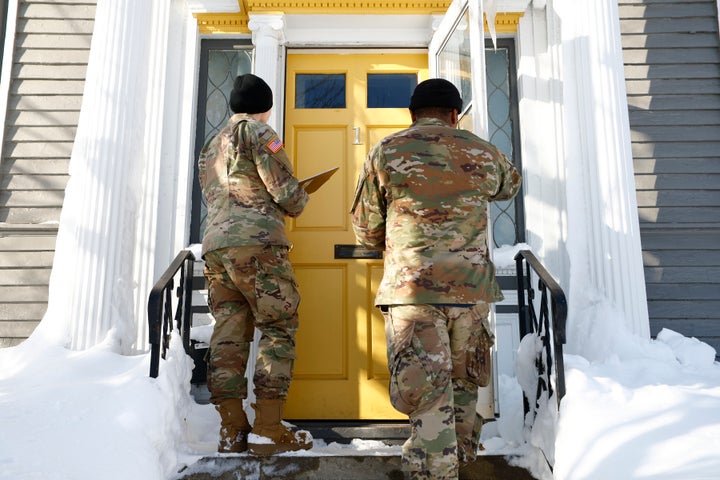 National guard members check on residents, Wednesday, Dec. 28, 2022, in Buffalo N.Y., following a winter storm. The National Guard went door to door in parts of Buffalo on Wednesday to check on people who lost power during the area’s deadliest winter storm in decades, and authorities faced the tragic possibility of finding more victims amid melting snow. (AP Photo/Jeffrey T. Barnes)