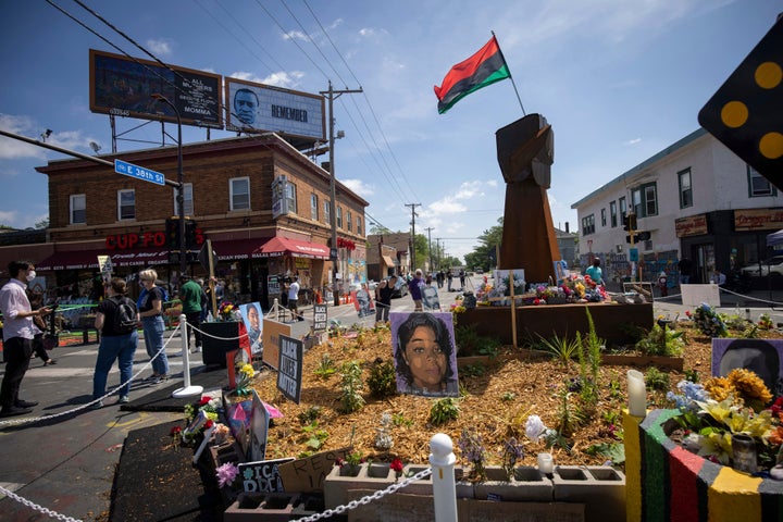 FILE – People walk through George Floyd Square on Tuesday, May 25, 2021, in Minneapolis. Justin Stetson, 34, faces one felony count of third-degree assault in connection with the May 30, 2020, beating of Jaleel Stallings. He would face up to five years in prison if convicted.