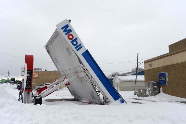 A gas station canopy lays on its side after high winds and heavy snow along Lake Shore Boulevard on December 27, 2022 in Lackawanna, New York.