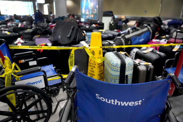 Wheelchairs and caution tape restrict access to the baggage claim area inside the Southwest Airlines terminal at St. Louis Lambert International Airport on Wednesday.