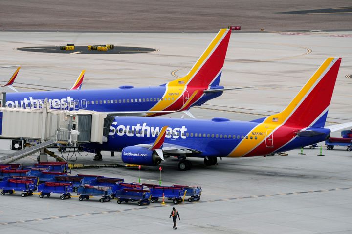 Southwest Airlines jets are parked at gates at Phoenix Sky Harbor International Airport on Thursday.
