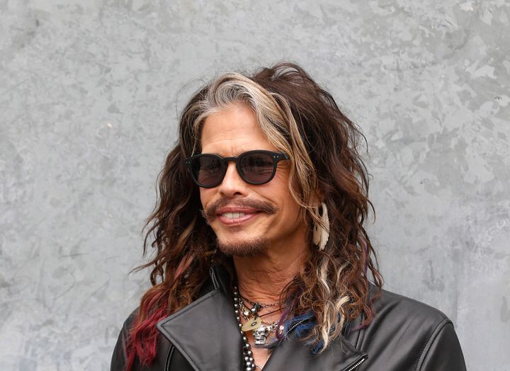 US rockstar Steven Tyler, singer of the Aerosmith group poses at his arrival to attend the Emporio Armani men's Spring-Summer 2015 show, part of the Milan Fashion Week, unveiled in Milan, Italy, Monday, June 23, 2014. (AP Photo/Luca Bruno)