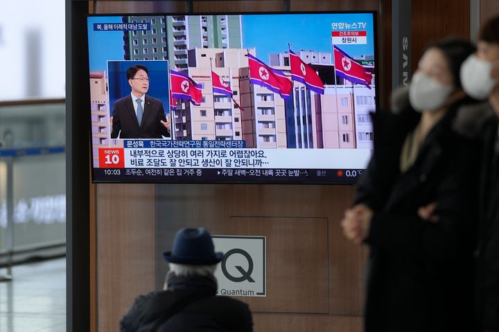 A TV screen shows a file image of North Korea's flags during a news program at the Seoul Railway Station in South Korea on Saturday. North Korea fired three short-range ballistic missiles toward its eastern waters on Saturday, the latest in a barrage of weapons tests this year that came days after it increased tensions by allegedly flying drones into South Korean airspace.