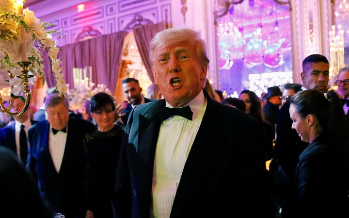 Former President Donald Trump, who announced a third run for the presidency in 2024, hosts a New Year's Eve party at his Mar-a-Lago resort in Palm Beach, Florida.