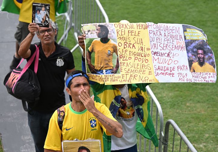 Fans of late Brazilian football legend Pele attend his wake at the Urbano Caldeira stadium in Santos, Sao Paulo, Brazil on January 2, 2023. (Photo by CARL DE SOUZA / AFP) (Photo by CARL DE SOUZA/AFP via Getty Images)