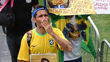  Fans Mourn Pel&eacute; At Public Viewing In Brazil Stadium