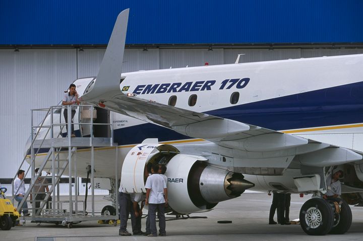 A file photo of engineers inspecting the engine cowling of a prototype Embraer 170. An Embraer 170 was the type of aircraft involved in the fatal accident in Montgomery, Alabama.