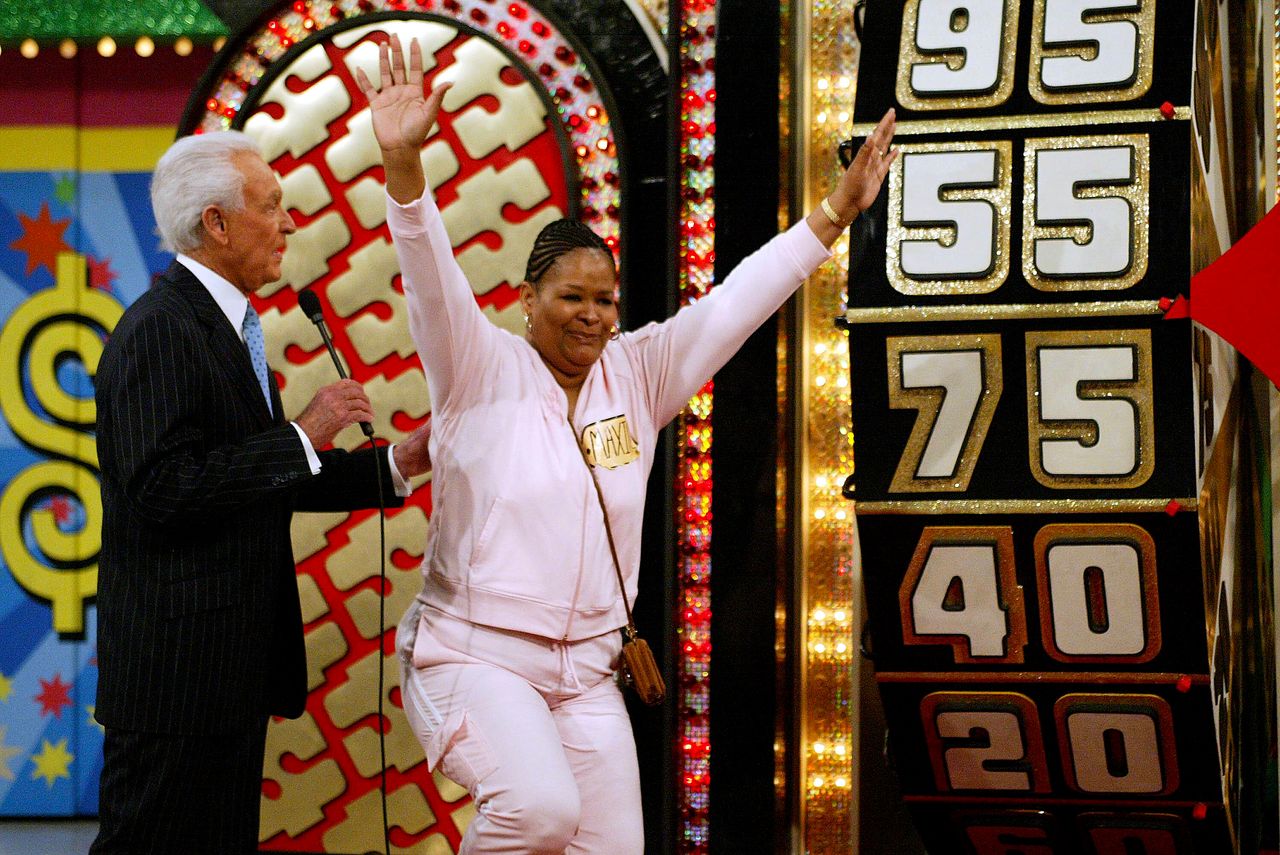 Barker stands beside a contestant during the 6,000th taping of "The Price Is Right" in Los Angeles on Feb. 19, 2004.