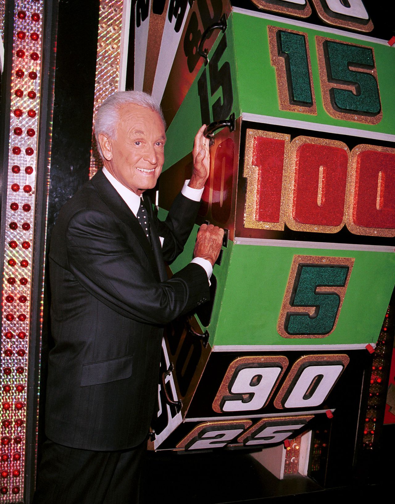 Barker poses by a game prop to celebrate his 30th anniversary as host of "The Price Is Right" in Los Angeles on June 6, 2001.