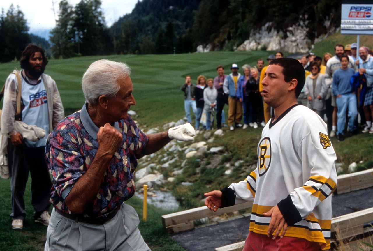 Barker prepares to punch actor Adam Sandler in a scene from the film "Happy Gilmore" in 1996.