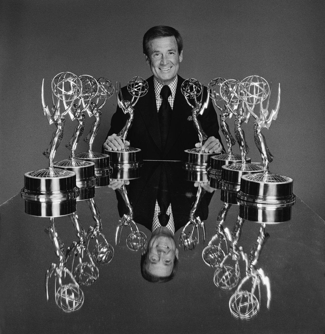 Barker sits at a table with a group of Emmy statues to publicize the Daytime Emmy Awards on March 17, 1976.