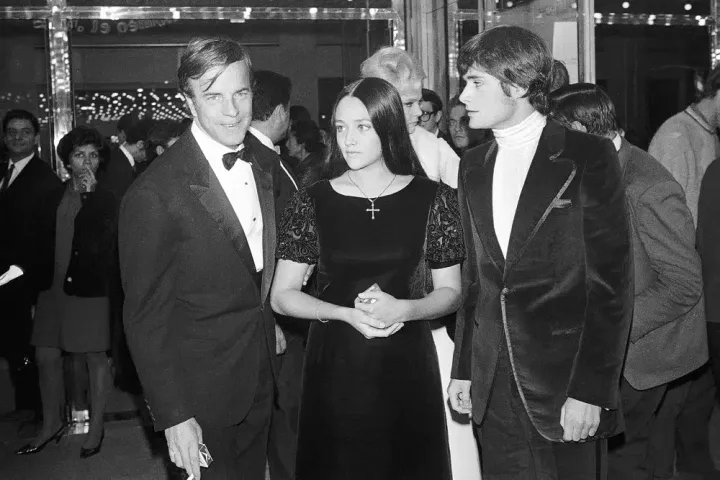 "Romeo and Juliette" movie director Franco Zeffirelli, left, actors Olivia Hussey, center, and Leonard Whiting are seen after the Parisian premiere of the film in Paris on Sept. 25, 1968. 