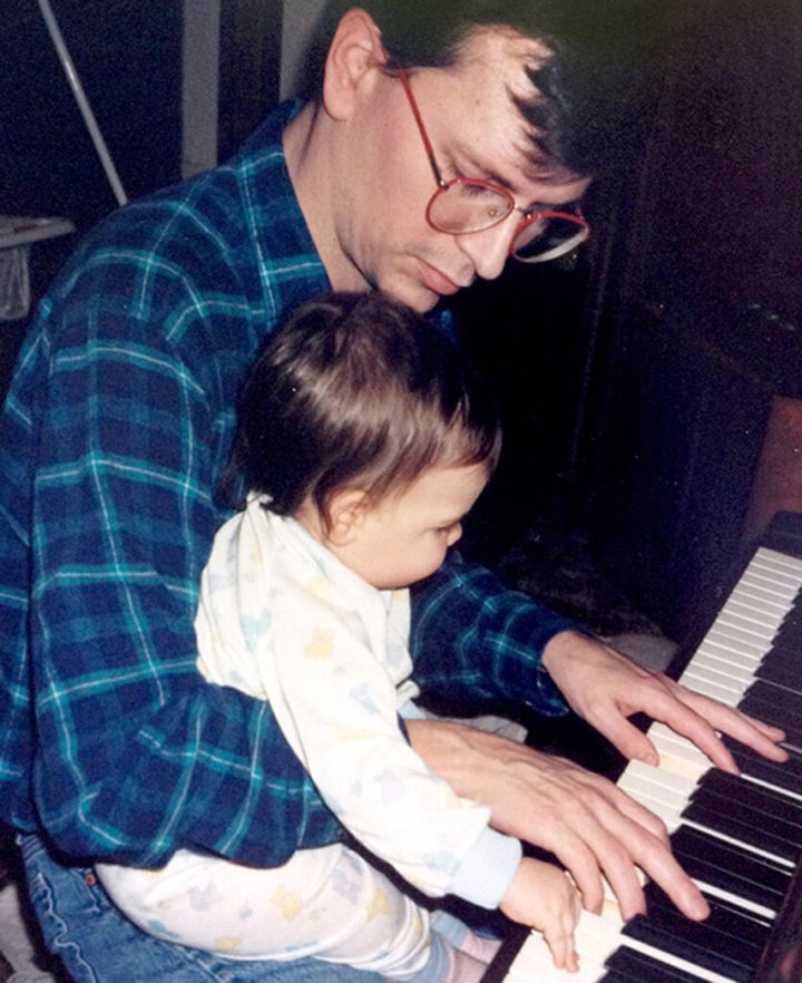 John passing on his love of music to Hannah before he could no longer play the piano.