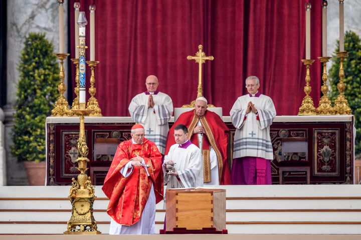 Pope Francis sits behind the coffin of Pope Emeritus Benedict XVI during the funeral mass at St. Peter's square on January 5, 2023 in Vatican City, Vatican. 