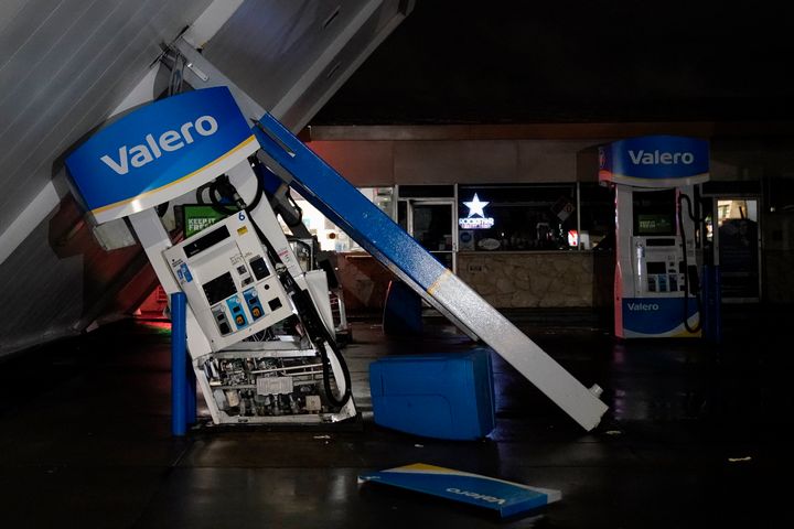 The canopy of gas station, toppled by strong winds, rests at an angle, on Jan. 4, 2023, in south San Francisco. 