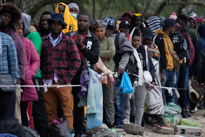 Haitian migrants who hope to apply for asylum in the U.S. wait to register their names on a list made by a religious organization in Reynosa, Mexico, Dec. 21, 2022, on the other side of the border with McAllen, Texas.