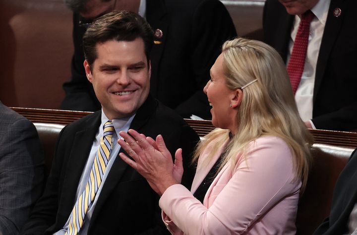 Rep Matt Gaetz (R-Fla.) laughs with Rep. Marjorie Taylor Greene (R-Ga.) after nominating former President Donald Trump during the third day of elections for speaker of the House on Thursday.