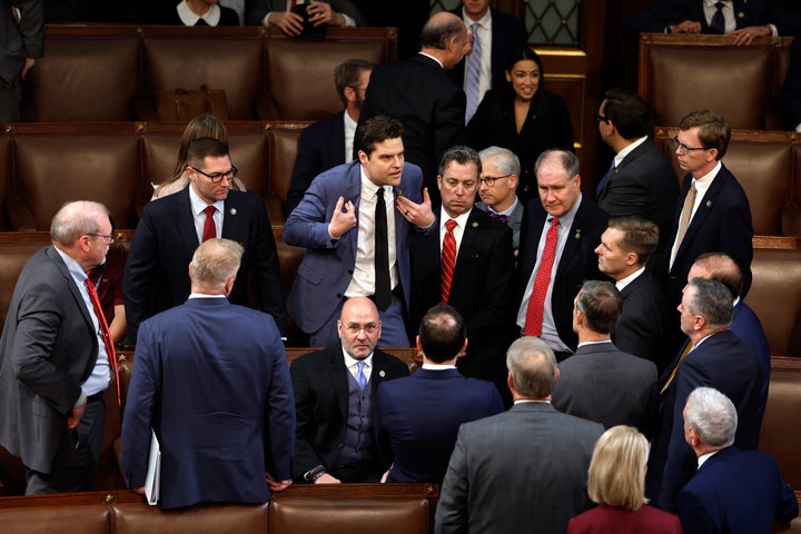 Rep. Matt Gaetz (R-Fla.) talks to fellow Republicans on Wednesday during the second day of elections for House speaker at the U.S. Capitol.