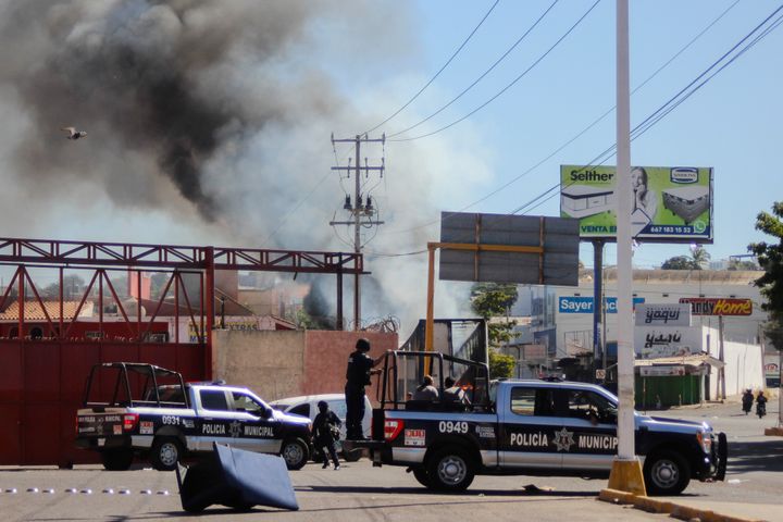 The police arrives on the scene after a store was looted in Culiacan, Sinaloa state, on Jan. 5, 2023. 