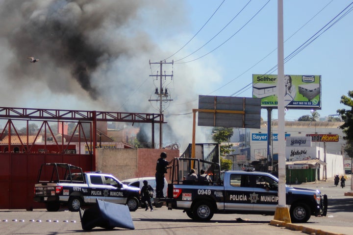 The police arrives on the scene after a store was looted in Culiacan, Sinaloa state, on Jan. 5, 2023.