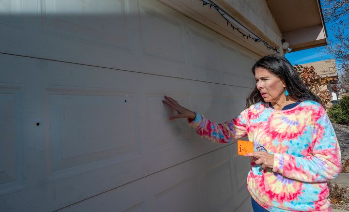 Sen. Linda Lopez , D-Albuquerque, shows bullet holes in her garage door after her Westside home was shot at last month on Thursday Jan. 5 , 2023 in Albuquerque, N.M. (Adolphe Pierre-Louis/The Albuquerque Journal via AP)