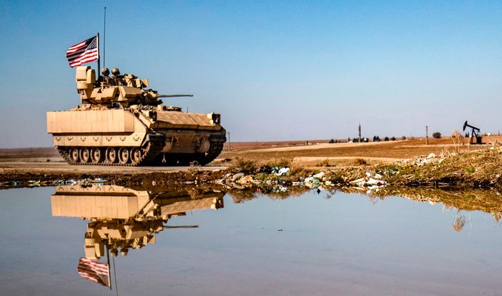 A U.S. Bradley Fighting Vehicle (BFV) patrols in the countryside near al-Malikiyah (Derik) in Syria's northeastern Hasakah province on February 2, 2021. (Photo by DELIL SOULEIMAN/AFP via Getty Images)