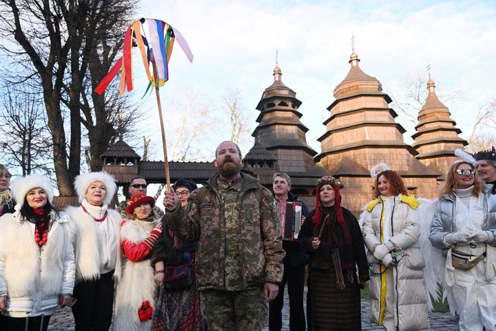 People dressed in costumes sing carols as they take part in Orthodox Christmas celebrations in the western Ukrainian city of Lviv.