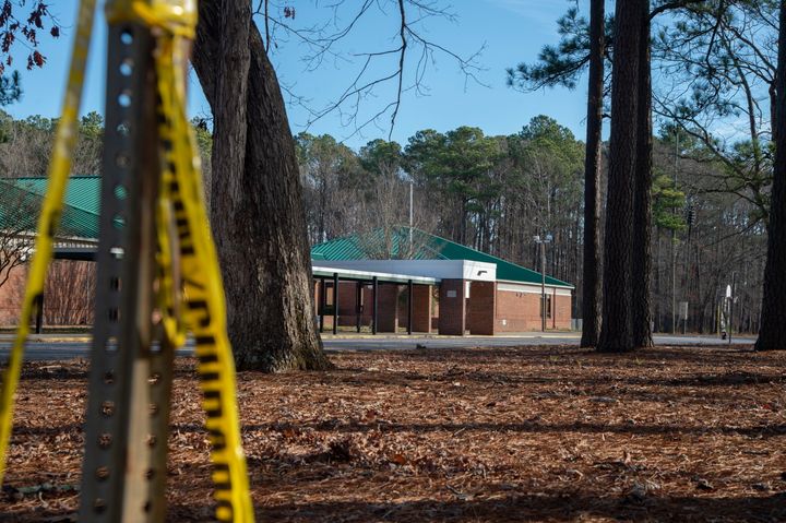 Police tape hangs from a sign post outside Richneck Elementary School on Jan. 7. 