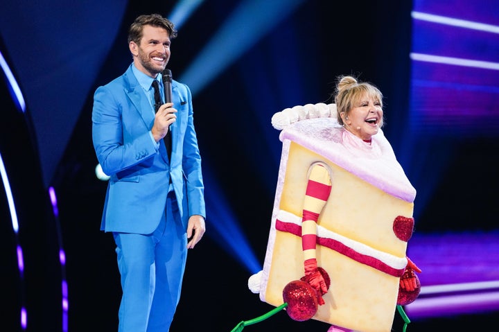 Lulu with Masked Singer presenter Joel Dommett after her unmasking