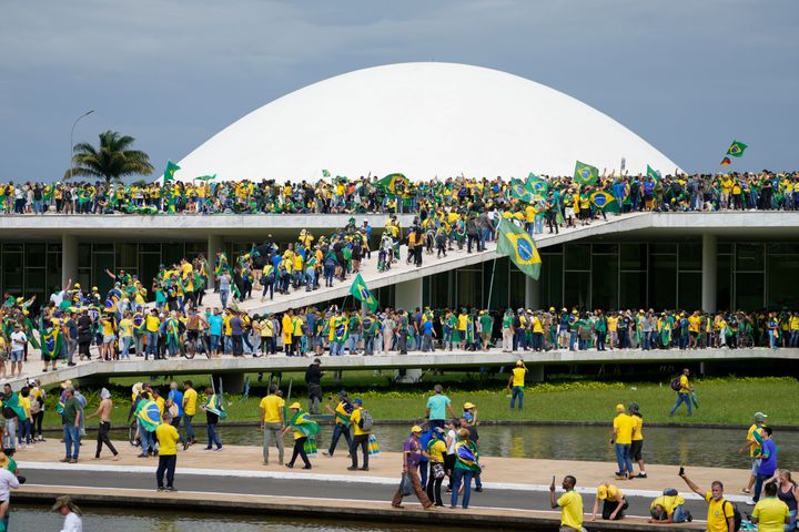 Protesters, supporters of Brazil's former President Jair Bolsonaro, storm the the National Congress building in Brasilia, Brazil, on Jan. 8, 2023. (AP Photo/Eraldo Peres)
