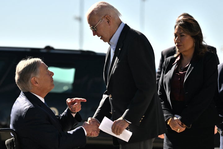 Biden shakes hands with Texas Governor Greg Abbott on Sunday after Abbott handed him a letter outlining the problems on the southern border.