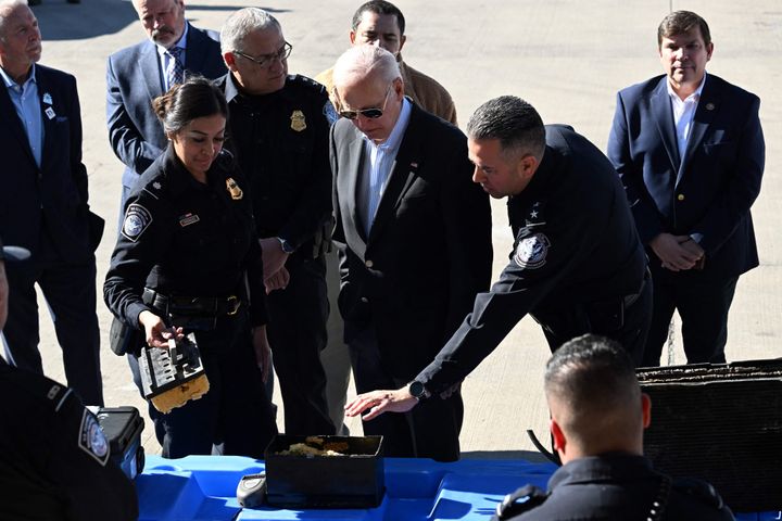 President Joe Biden looks at a fake battery used for smuggling drugs on the Bridge of the Americas border crossing between Mexico and the U.S in El Paso, Texas, on Sunday.
