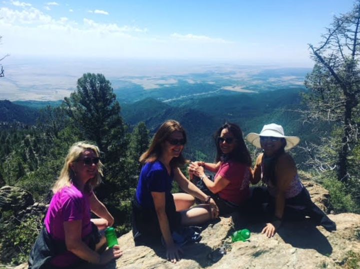 The author (far right, in the hat) with her three best friends on a post-wedding hike in Colorado.