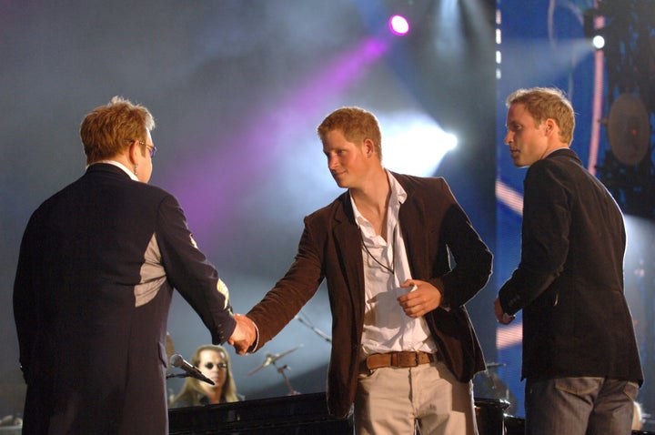 Sir Elton on stage with Princes William and Harry in 2007