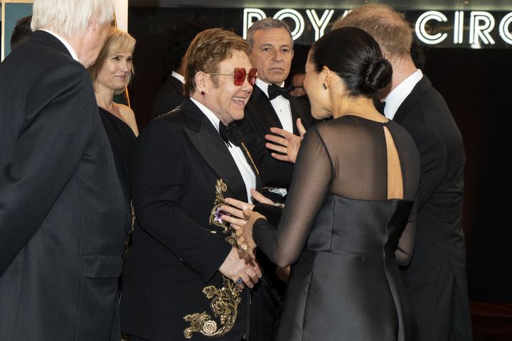 Sir Elton talking to Meghan Markle in 2019 at the premiere of The Lion King